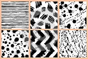 Abstract watercolor vector seamless pattern. Zigzag, stripes, blots, stains fashion textile print in black white colors