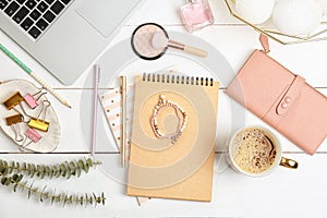 Set of accessories, cosmetics and laptop on wooden background, flat lay. Beauty blogging