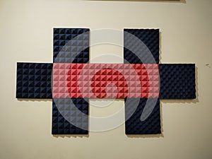 A set of Acoustic foam panel are placed on the wall to absorb noise.