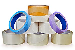 Set of adhesive tape is stacked in form of pyramid.