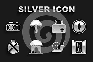 Set African hut, Compass, Waterfall, Snail, Canteen water bottle, First aid kit, Photo camera and Mushroom icon. Vector