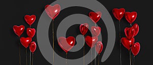 Set of Air Balloons. Bunch of red color heart shaped foil balloons isolated on black background. Love. Holiday celebration.