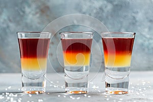 Set alcohol shot in cocktail glass. Layered Alcoholic Cocktails