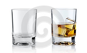 Set of alcoholic beverages. Scotch whiskey in elegant glass with ice cubes on white background