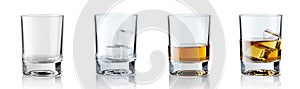 Set of alcoholic beverages. Scotch whiskey in elegant glass with ice cubes on white background