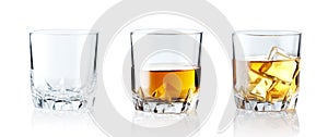 Set of alcoholic beverages. Scotch whiskey in elegant glass with ice cubes on white background