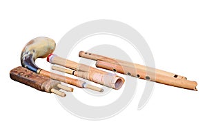 A set of ancient woodwind musical instruments, isolated on a white ba