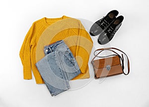 Set with ankle boots, stylish clothes and bag on background, top view