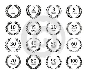 Set of anniversary laurel wreaths. Black and white anniversary symbols isolated on black background. 1, 2, 3, 5, 10, 15, 20, 25,