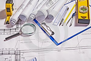 Set of architect tools on white blueprint