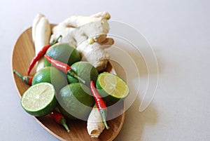 Set of asian spices: kaffir limes, lemongrass, bird`s eye chilis, ginger.