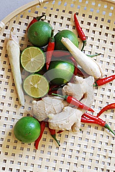 Set of asian spices: kaffir limes, lemongrass, bird`s eye chilis, ginger.