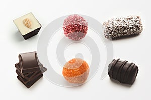 Set of assorted chocolate candies on white background