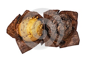 Set of assorted muffins in brown paper isolated on white background, top view