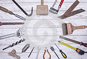 Set of assorted tools for construction works. on a wooden board. copy space
