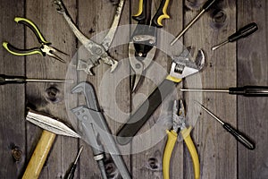Set of assorted work carpentry and locksmith tools on a dark wooden background with copy space