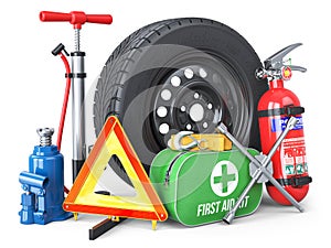 A set of automotive accessories. Spare wheel, fire extinguisher, first aid kit, emergency warning triangle, jack, tow rope, wheel