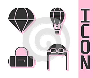 Set Aviator hat with goggles, Parachute, Suitcase and Hot air balloon icon. Vector
