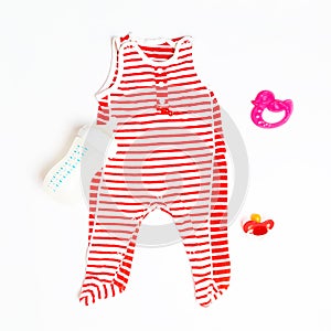 Set of baby clothes and accessories on white background. jumpsuit baby and toys. Fashion newborn. Flat lay, top view