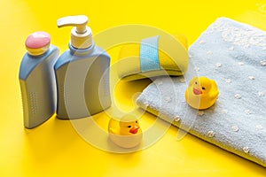 Set of baby hygiene and bath items with shampoo bottle and soap