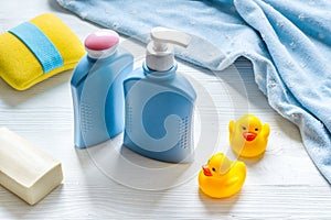 Set of baby hygiene and bath items with shampoo bottle and soap