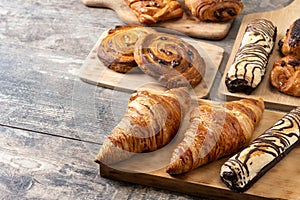 Set of bakery pastries on wooden table