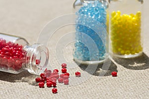 Set of beads in glass bottles. Beading, handmade women`s jewelry