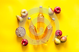 Set of beer bottles with apple, pears, wheat top-down