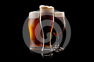 Set of Beer glasses on a black background. Mugs with drink like Ipa, Pale Ale, Pilsner, Porter or Stout