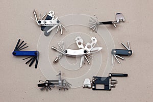 Set of bicycle multi tools on grey background.