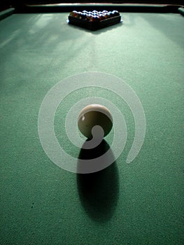 A set of billiard balls with a white cue ball