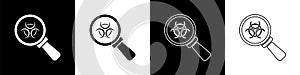 Set Biohazard and magnifying glass icon isolated on black and white background. Vector