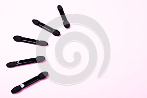 Set of black applicators.