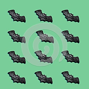 Set of black bats  on green color background. Halloween ornament is colorful Tones