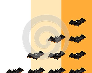 Set of black bats isolated on orange, white with beige colors background. Halloween ornament is colorful Tones