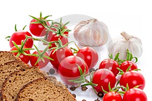 Set of black bread, tomatoes and garlic