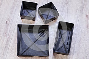 Set of black foldable storage boxes of cloth