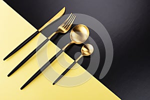 Set of black and gold cutlery