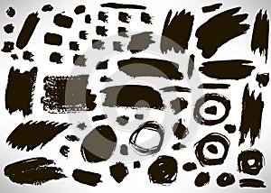 Set of black hand drawn grunge elements, geometrical shapes, dots, rings, circles, banners, brush strokes isolated