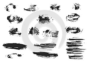Set of black ink splashes and drops. Hand drawn spray design elements. Blobs and spatters on a white background. Isolated vector