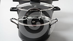 Set of black pots on a white background. Utensils for cooking