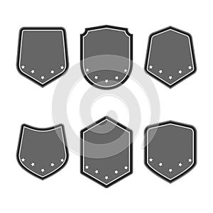 Set of black shields with stars in trendy flat style isolated on white background. Herald logo and medieval Shield symbol for your