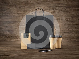 Set of black shopping bag, craft package, two brown coffee cups, blank business cards and generic design smartphone