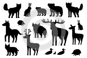 Set of black silhouette forest animals. Cartoon isolated vector fox, wolf, bear, bear cub, elk deer, fallow deer hedgehog, hare,