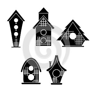 Set of black silhouette of simple bird houses on a white background. Vector print illustration of small homes