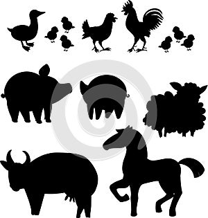 Set of black silhouettes of different cartoon farm animals on white background