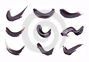 Set of Black strokes of mascara on a white background. Texture of black mascara for eyelashes isolatedon white. Smear of