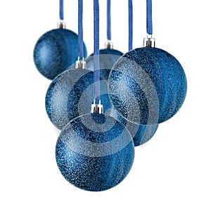 Set of blue Christmas ornaments hanging over white background. Christmas tree decorations isolated on white