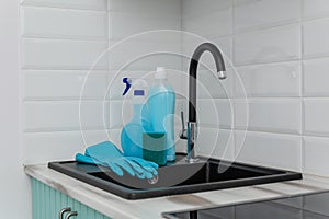 A set of blue cleaning products and tools for cleaning