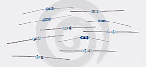 Set of blue miniature carbon resistors on a white background